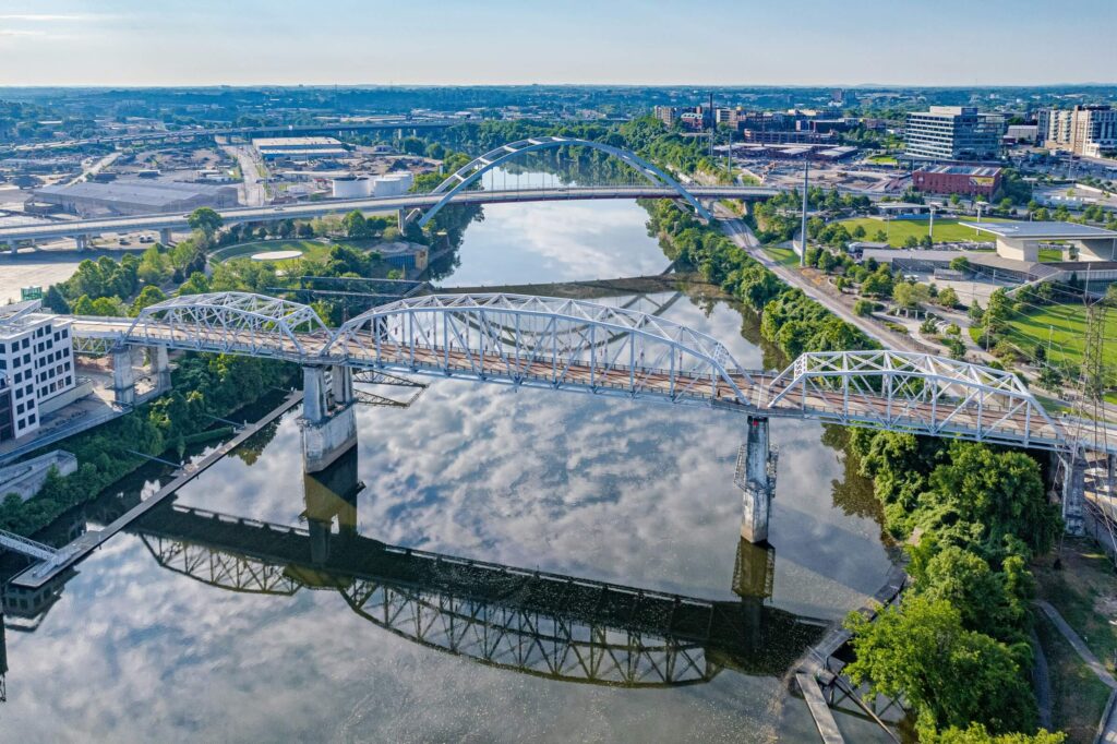 Bridges crossing the Cumberland River with reflection in Nashville.